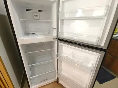 an empty refrigerator with its door open in a kitchen at M-Vertica Sunway Velocity Cheras by Luvit Stay in Kuala Lumpur