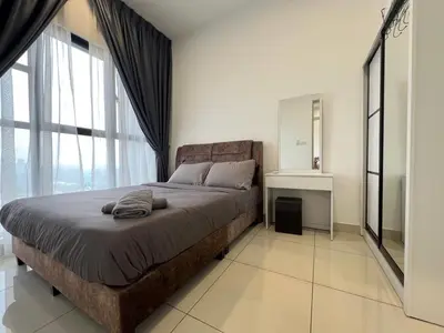 a bedroom with a large bed and a large window at Trion KL by Dreamcloud Sdn Bhd in Kuala Lumpur