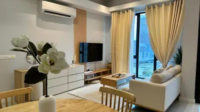 a living room with a couch and a tv at Sentral 108 Home Brickfields Bangsar Kuala Lumpur 2-5Pax in Kuala Lumpur