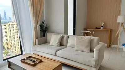 a living room with a couch and a large window at Sentral 108 Home Brickfields Bangsar Kuala Lumpur 2-5Pax in Kuala Lumpur
