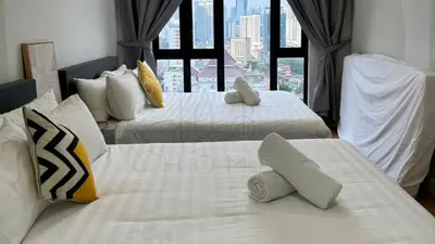 three beds in a hotel room with a window at Sentral 108 Home Brickfields Bangsar Kuala Lumpur 2-5Pax in Kuala Lumpur