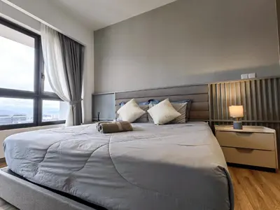 a bedroom with a large bed with a large window at TRX Agile Bukit Bintang KLCC View 8pax Family Suites in Kuala Lumpur