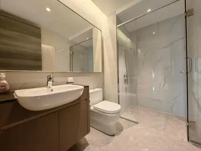 a bathroom with a sink and a toilet and a shower at TRX Agile Bukit Bintang KLCC View 8pax Family Suites in Kuala Lumpur
