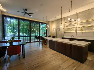 a kitchen with a sink and a table and chairs at TRX Agile Bukit Bintang KLCC View 8pax Family Suites in Kuala Lumpur