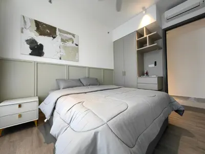 a bedroom with a large white bed and a window at TRX Agile Bukit Bintang KLCC View 8pax Family Suites in Kuala Lumpur