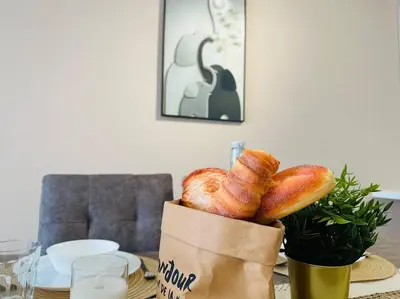 a table with a bag of bread on a table at MVC50#Family Suite 9pax 3 Rooms M Vertica Velocity Mall Cheras in Kuala Lumpur