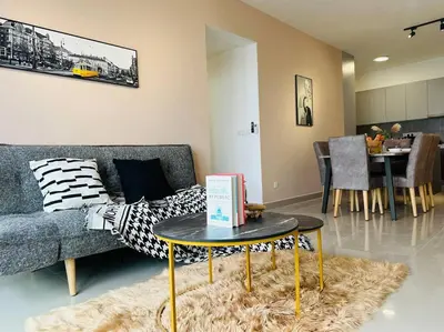 a living room with a couch and a table at MVC50#Family Suite 9pax 3 Rooms M Vertica Velocity Mall Cheras in Kuala Lumpur