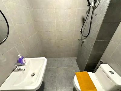 a bathroom with a sink and a toilet and a shower at Neu Suites Junior Suite By Serenity Homes Next to Gleneagles & LRT in Kuala Lumpur