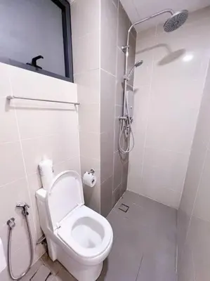 a white bathroom with a toilet and a shower at PROMO 2 ROOM Nice Design KL Gateway Residence 27 in Kuala Lumpur