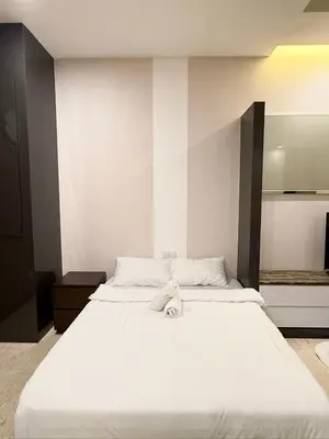 a large white bed in a room at Dorsett 1 min to TRX Pavilion 127 in Kuala Lumpur