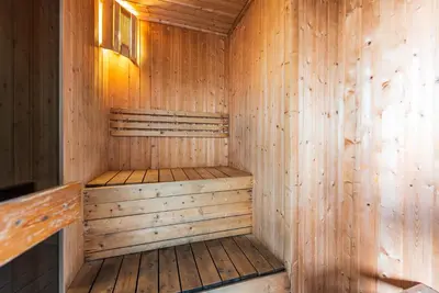 a wooden sauna with wooden floors and walls at Dorsett 1 min to TRX Pavilion 127 in Kuala Lumpur