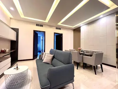 a living room with a couch and a table at Dorsett 1 min to TRX Pavilion 127 in Kuala Lumpur