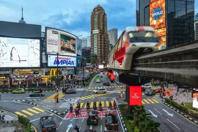 a busy city street with cars on the road at Kingston Hotel 4 - Hulo Bukit Bintang in Kuala Lumpur