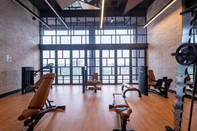 a gym with a bunch of exercise equipment in a room at Societe Studio Sri Hartamas By Feel Home in Kuala Lumpur