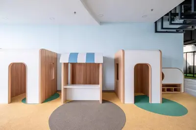 a room with a desk and a table with a rug at Societe Studio Sri Hartamas By Feel Home in Kuala Lumpur