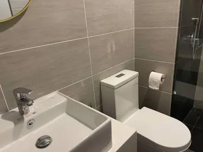 a bathroom with a white toilet and a sink at Classic couple suite-Netflix-Free-Park Trion B6205St KL in Kuala Lumpur