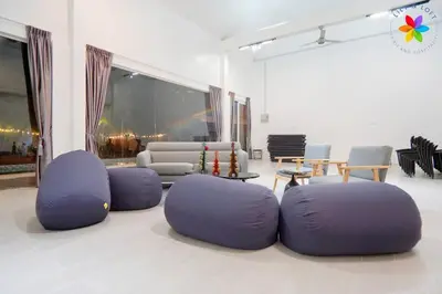 a room with purple ottomans in a living room at 30P White House Retreat - Pool & Event Hall in Kuala Lumpur