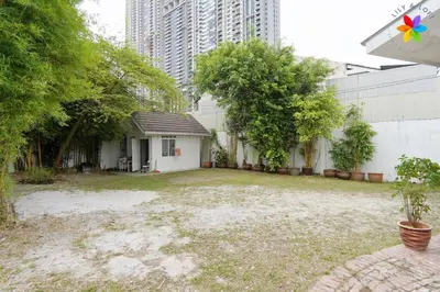 an empty yard with a house in a city at 30P White House Retreat - Pool & Event Hall in Kuala Lumpur