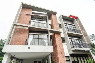 a tall brick building with balconies on it at The Heritage Mid Valley l KL Sentral l 8 Pax in Kuala Lumpur