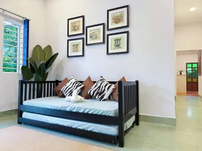 a bed with pillows on it in a room at The Heritage Mid Valley l KL Sentral l 8 Pax in Kuala Lumpur