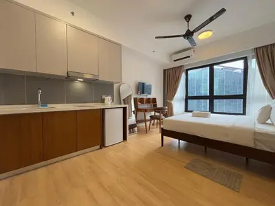 a bedroom with a bed and a sink and a kitchen at Agile Bukit Bintang FaceHome, TRX, Pavilion, KL in Kuala Lumpur