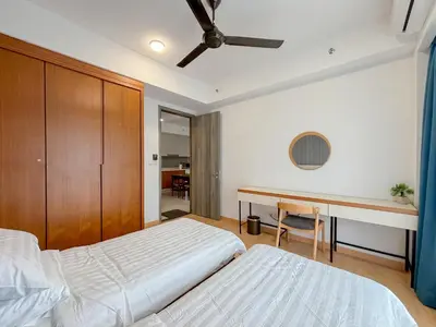 a bedroom with two beds and a desk at Agile Bukit Bintang FaceHome, TRX, Pavilion, KL in Kuala Lumpur