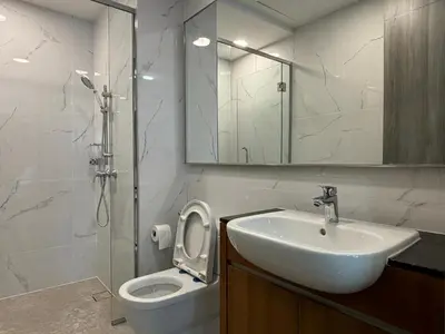 a bathroom with a sink and a toilet and a mirror at Agile Bukit Bintang FaceHome, TRX, Pavilion, KL in Kuala Lumpur