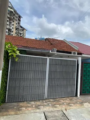 a garage gate in front of a house at Miharja Studio Private room with Auto gate Parking in Kuala Lumpur