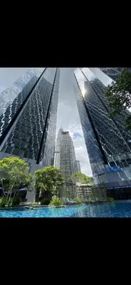 two tall buildings with trees in front of them at Star Residences One in Kuala Lumpur