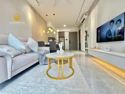 a living room with a couch and a table at Agile Residence Bukit Bintang By Heystay Management in Kuala Lumpur