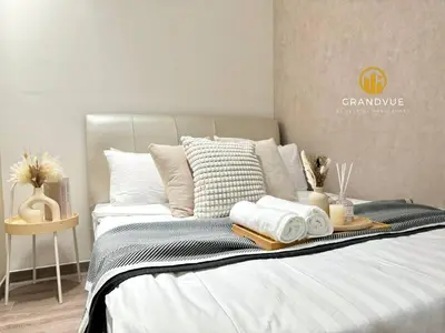a bed with a tray of towels on it at Agile Residence Bukit Bintang By Heystay Management in Kuala Lumpur