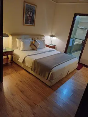 a bedroom with a large bed and a window at Kuala Lumpur Grand service suite at Times Square in Kuala Lumpur