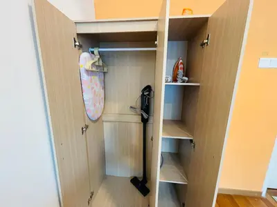 a walk in closet with a door open at Reizz Residence Ampang by DeUrban in Kuala Lumpur