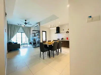 a dining room and kitchen with a table and chairs at Reizz Residence Ampang by DeUrban in Kuala Lumpur