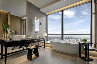 a bathroom with two sinks and a tub and a large window at Park Hyatt Kuala Lumpur in Kuala Lumpur