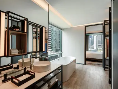 a bathroom with a tub and a large window at Hyatt Centric City Centre Kuala Lumpur in Kuala Lumpur