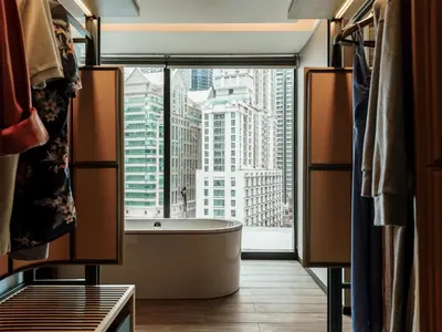 a bathroom with a tub and a large window at Hyatt Centric City Centre Kuala Lumpur in Kuala Lumpur