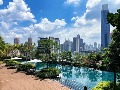 a swimming pool with a city skyline in the background at Continew Residence by Janice's Homestay in Kuala Lumpur