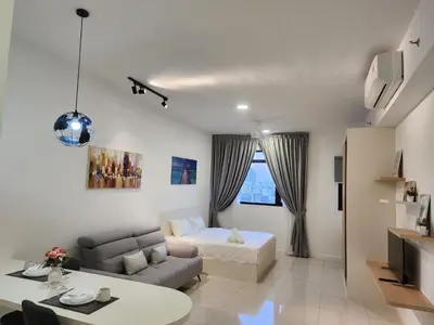 a living room with a couch and a table at Chambers Residence Suites Couple Studio in Kuala Lumpur