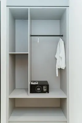 a walk in closet with a radio in it at Brilliant Hotel Dan Spa in Kuala Lumpur
