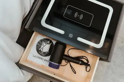 a box with a flashlight and a pen on a table at Brilliant Hotel Dan Spa in Kuala Lumpur