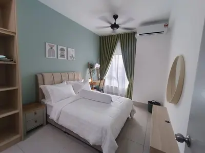 a bedroom with a white bed and a window at KLCC View 3BR 3Bath at RC Residence by Rosaz in Kuala Lumpur