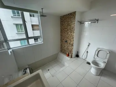 a bathroom with a toilet and a sink and a window at Solaris Dutamas by Manhattan Group in Kuala Lumpur