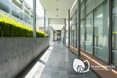 an empty hallway in a building with glass windows at The Signature Serviced Apartment at Sri Hartamas in Kuala Lumpur