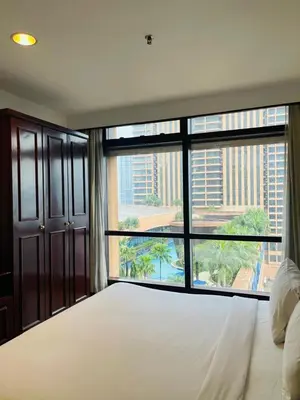 a bedroom with a large bed and a large window at Royal empire suite At Times square kl in Kuala Lumpur