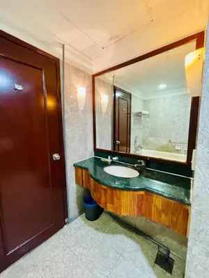a bathroom with a sink and a large mirror at Royal empire suite At Times square kl in Kuala Lumpur