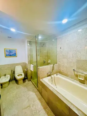 a bathroom with a toilet and a tub and a sink at Royal empire suite At Times square kl in Kuala Lumpur