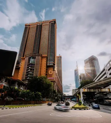 a city with tall buildings and a street with cars at Royal empire suite At Times square kl in Kuala Lumpur
