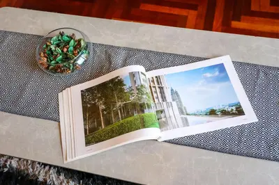 an open book sitting on a table with a book at The Mews KLCC by GB in Kuala Lumpur