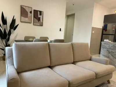 a living room with a couch and a table at TRION 2, KLCC TRX IKEA at Chan Sow Lin, Kuala Lumpur by One Guesthouse in Kuala Lumpur